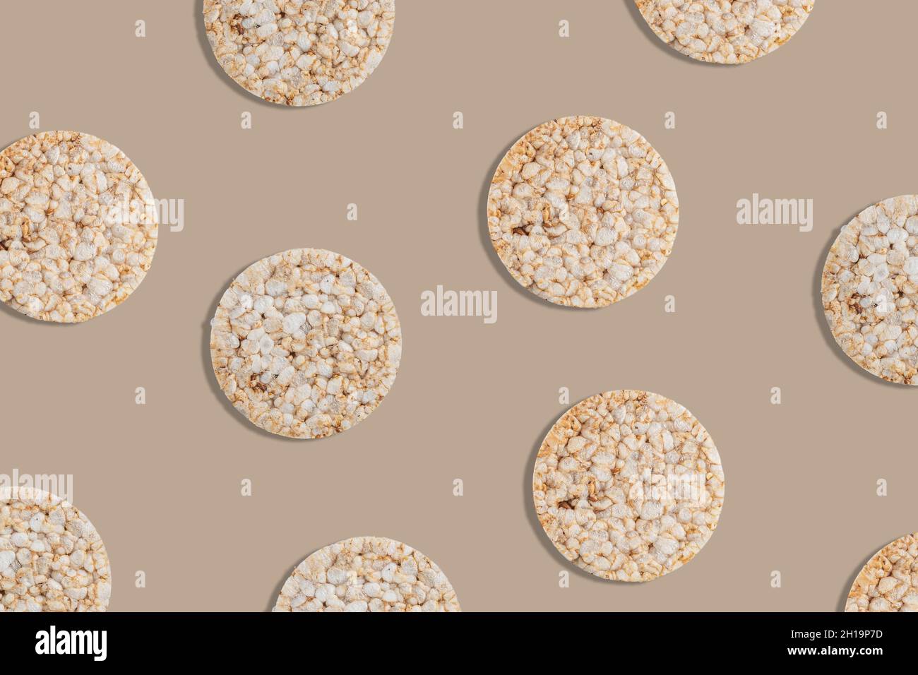 Creative pattern of rice cakes on bright background. Healthy lifestyle concept. Top view. Stock Photo