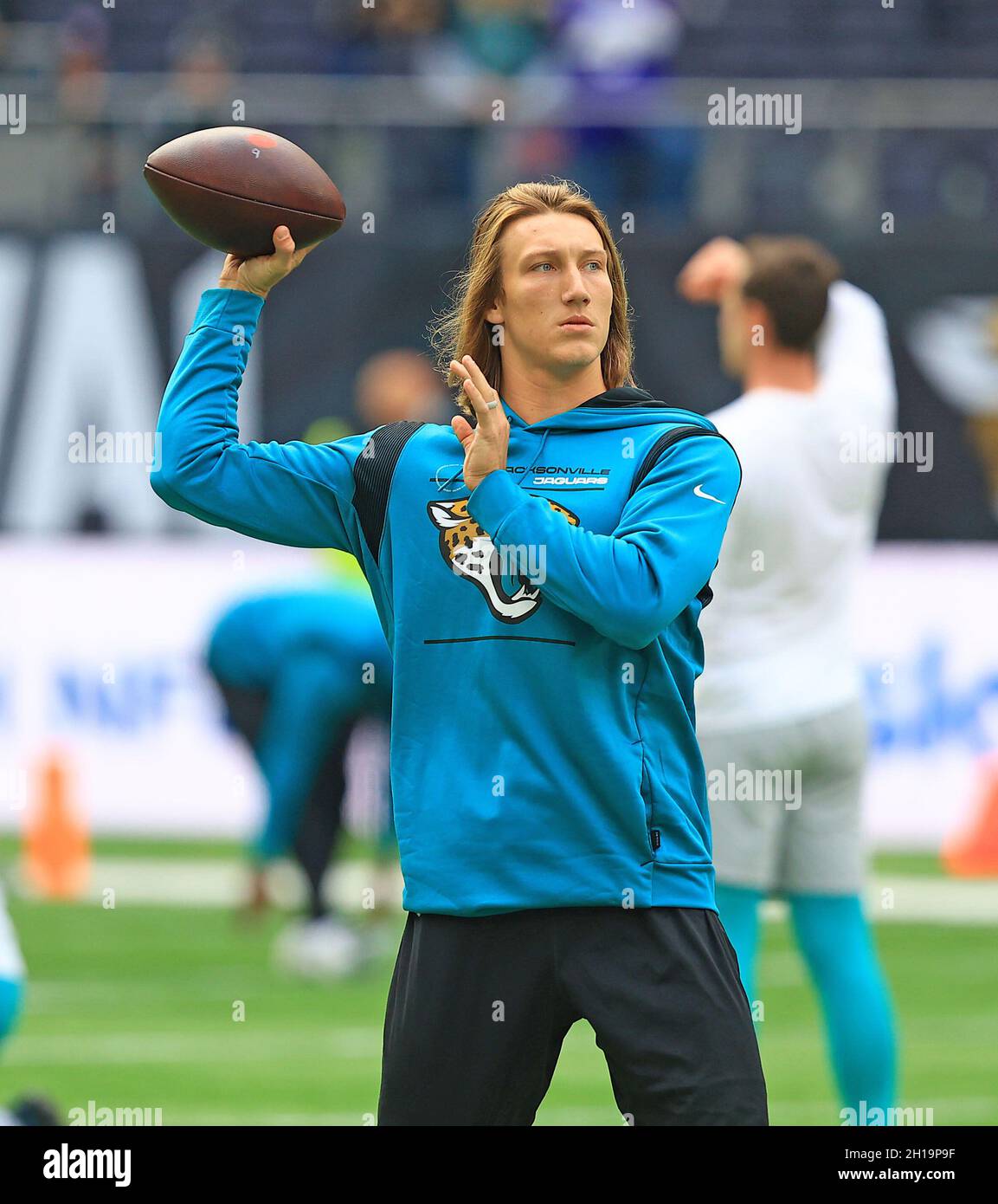 Trevor Lawrence Jacksonville Jaguars Unsigned White Jersey Passing Photograph