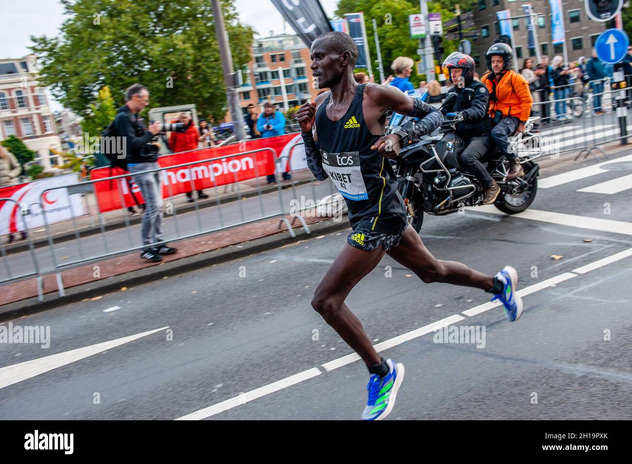Kenyan runner, Duncan Kibet is seen with both legs in the air during the  marathon.Last year, the marathon was canceled due to the coronavirus, but  with 31,000 registrations for the 2021 edition,
