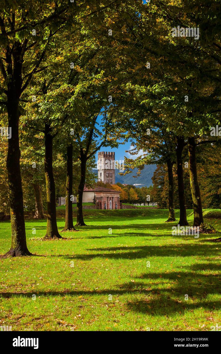 The Walls of Lucca public park with St Mary Gate and St Frediano medieval bell tower seen from St Martino Bulwark Stock Photo