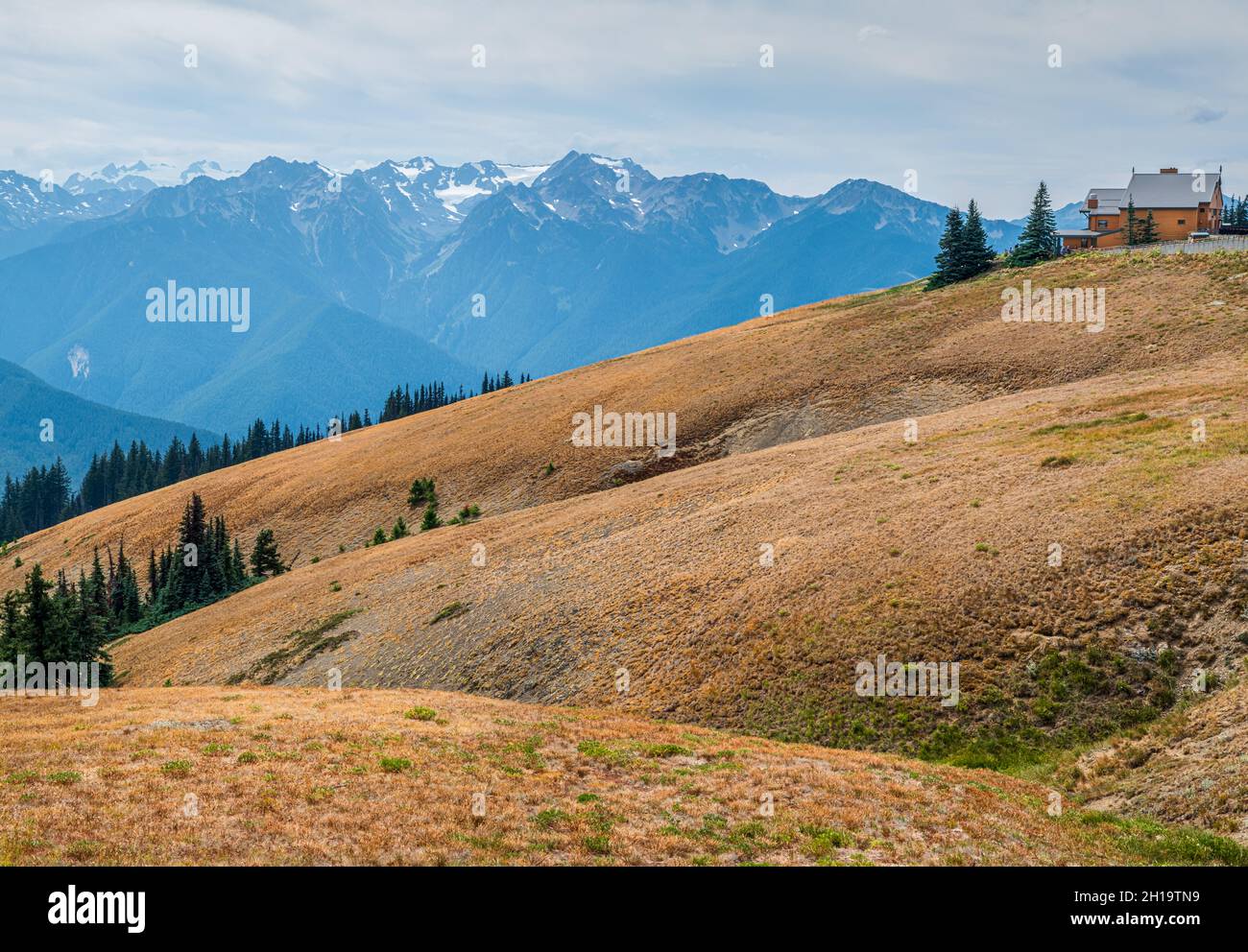 Man-made structures contrast against the natural beauty of Hurricane Ridge and the Olympic Mountains Stock Photo