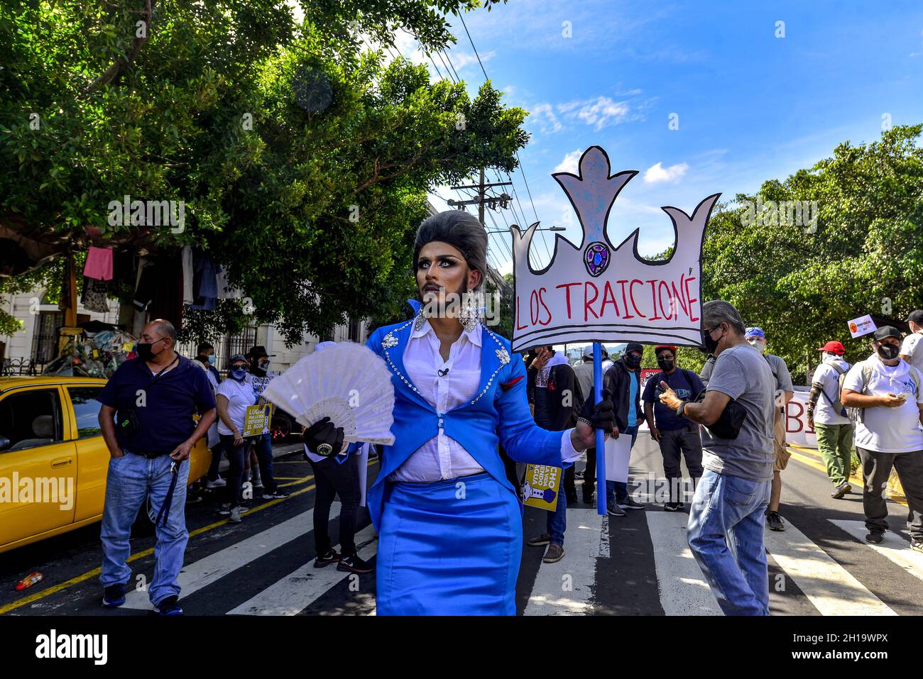 San Salvador, El Salvador. 17th Oct, 2021. A transgender protester holds an  anti-government sign during the protest.Thousands of Salvadorans take to  the streets to protest against the government of Nayib Bukele and
