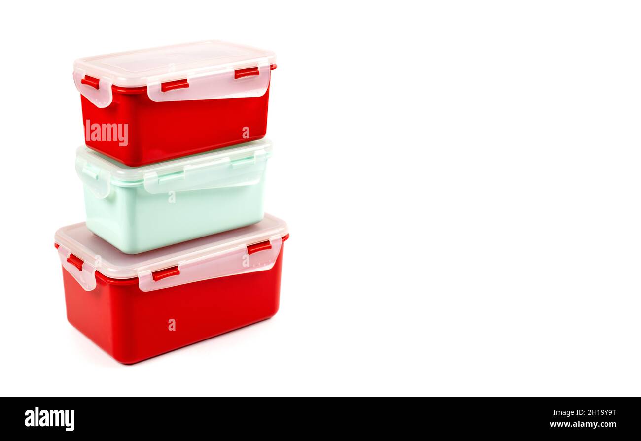 Plastic containers of different sizes for food products isolated on white background with copy