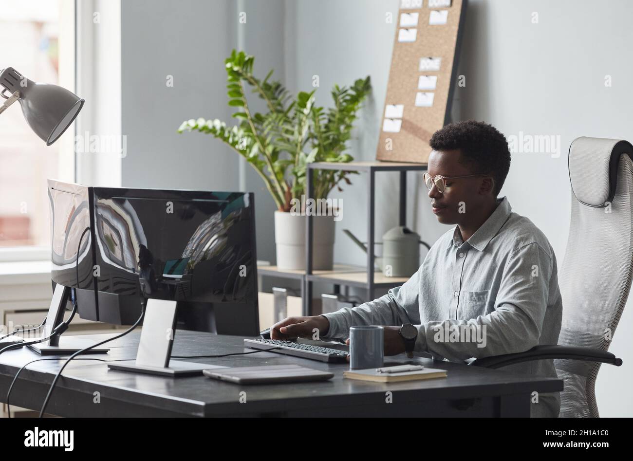 Portrait focused software developer writing hi-res stock photography ...