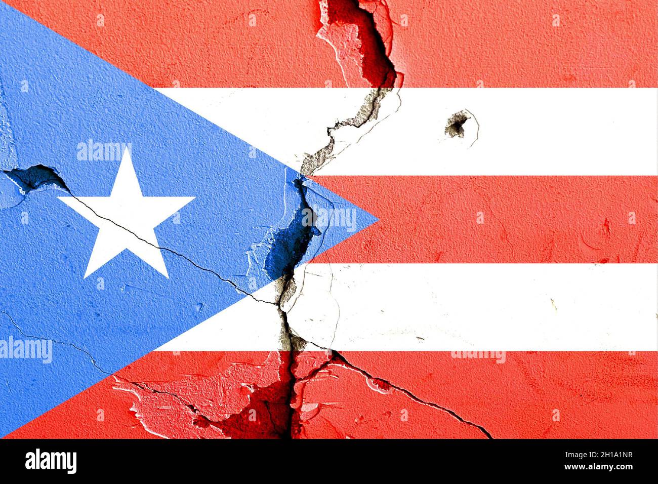 The Commonwealth of Puerto Rico flag painted on broken wall background ...