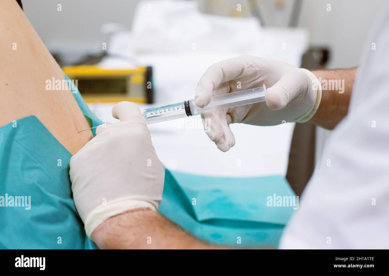Orthopedic doctor injecting cortisone in slipped disc Stock Photo
