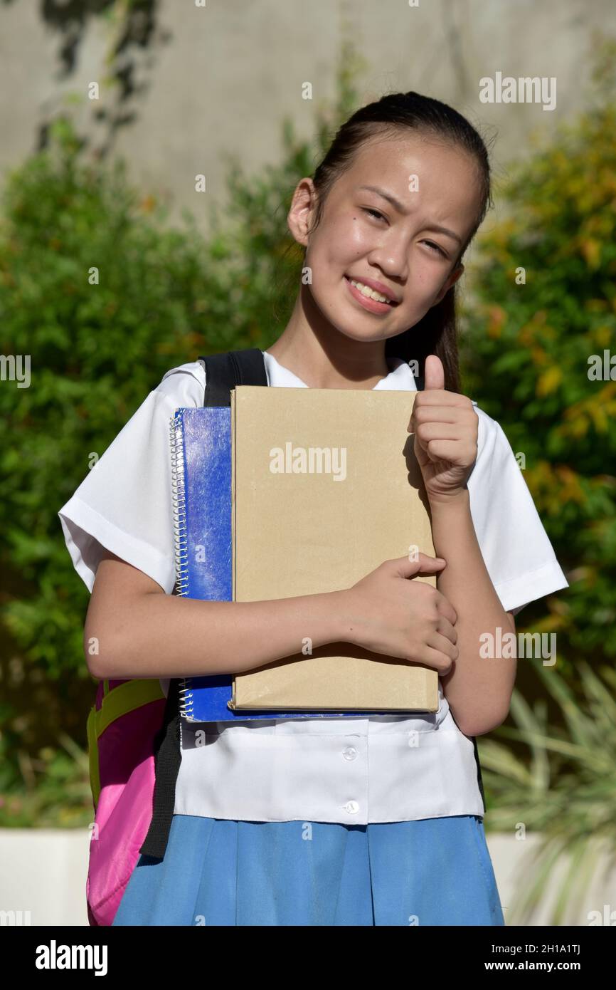 Student Teenager School Girl With Thumbs Up With Textbooks Stock Photo ...