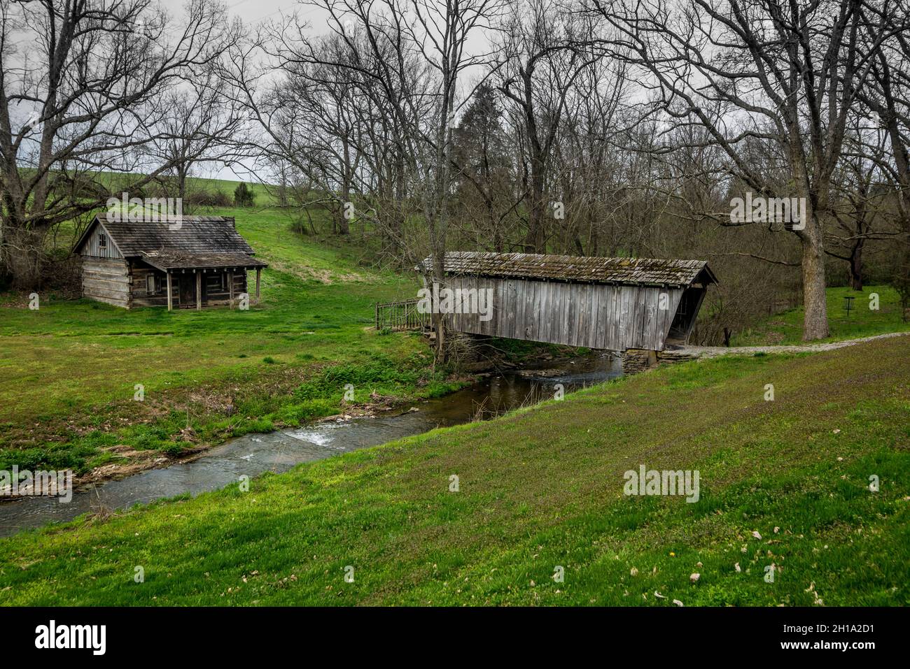 Old Covered Bridge and Log Cabin - North-central Kentucky Stock Photo