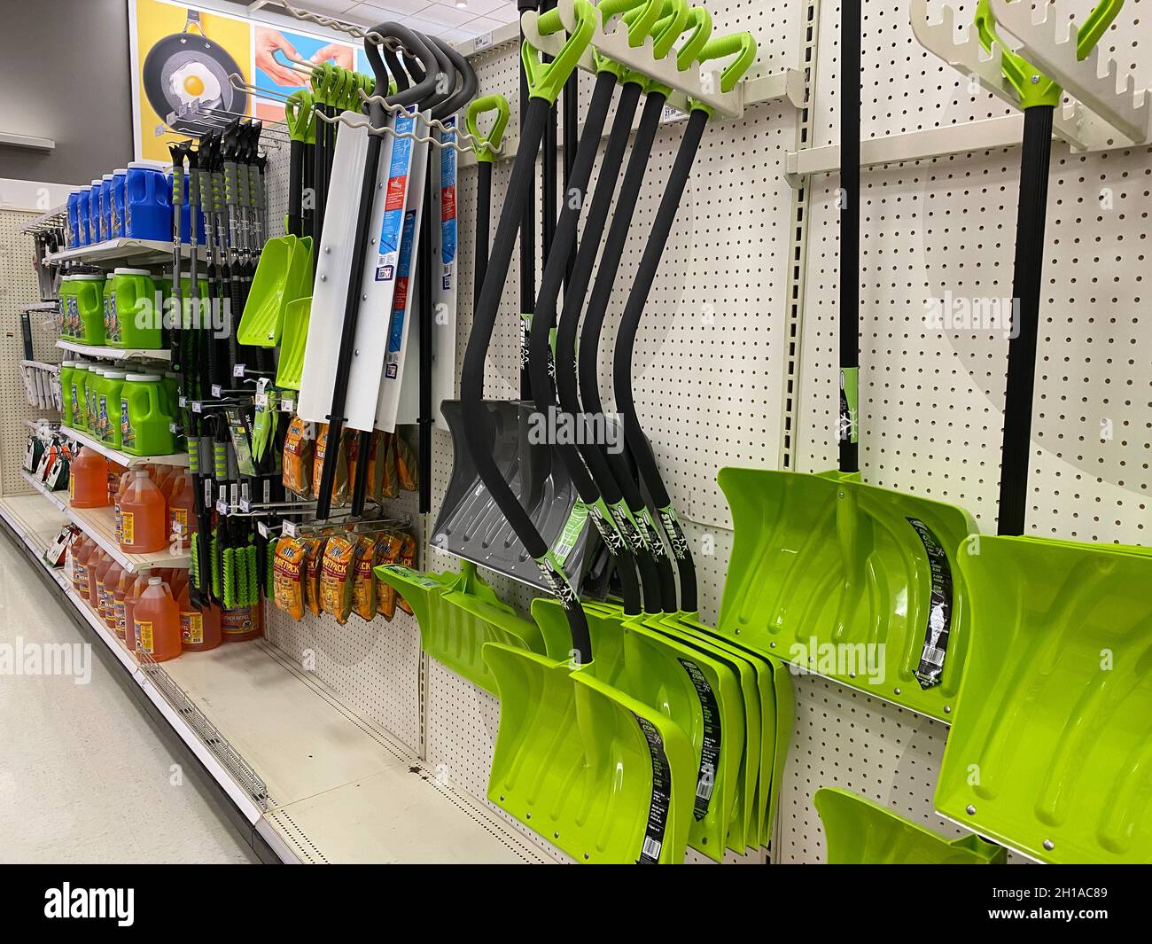 Snow shovels and ice removal products on display at a Chicago area