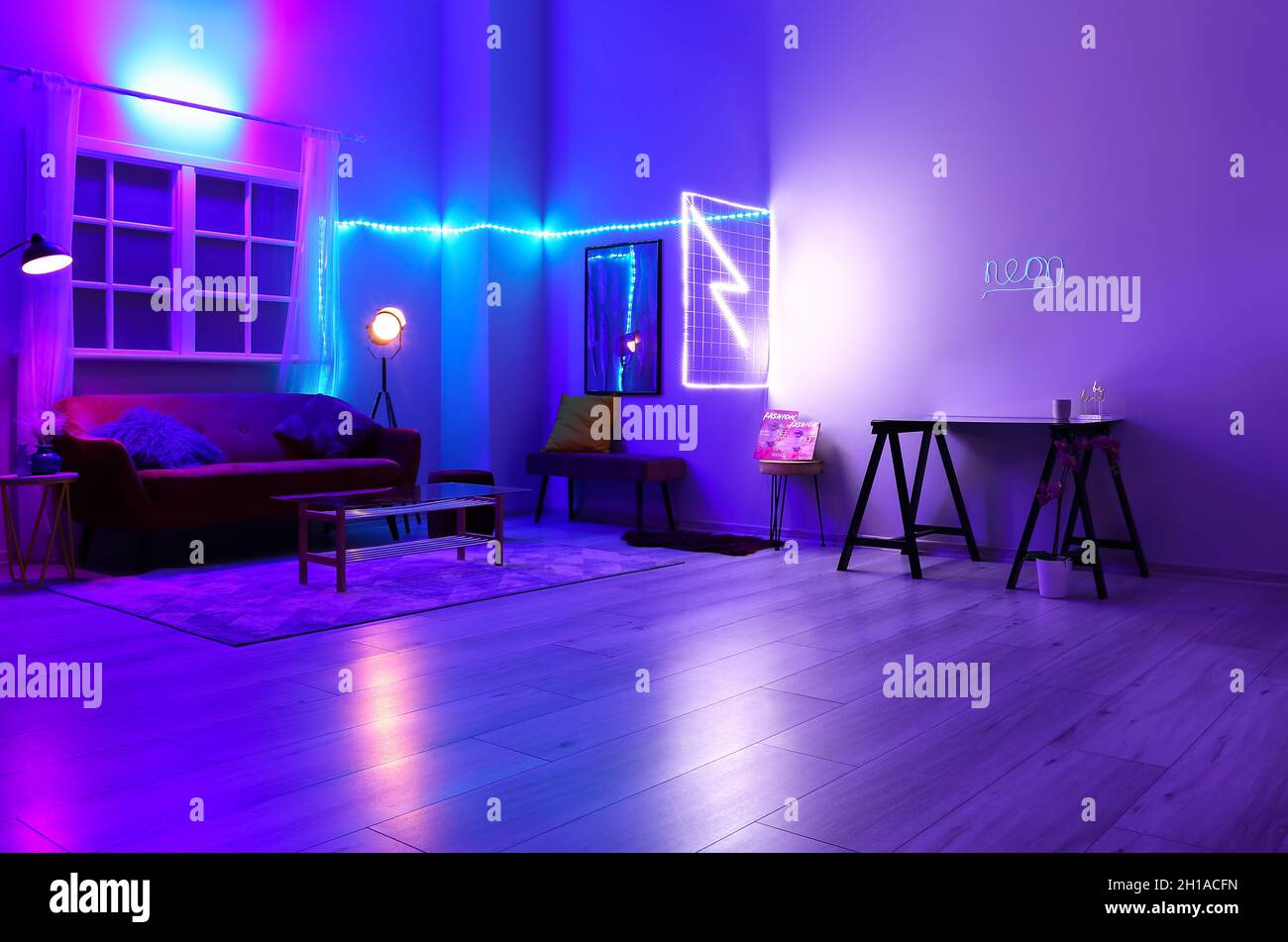 Interior of stylish living room with neon lighting Stock Photo Alamy