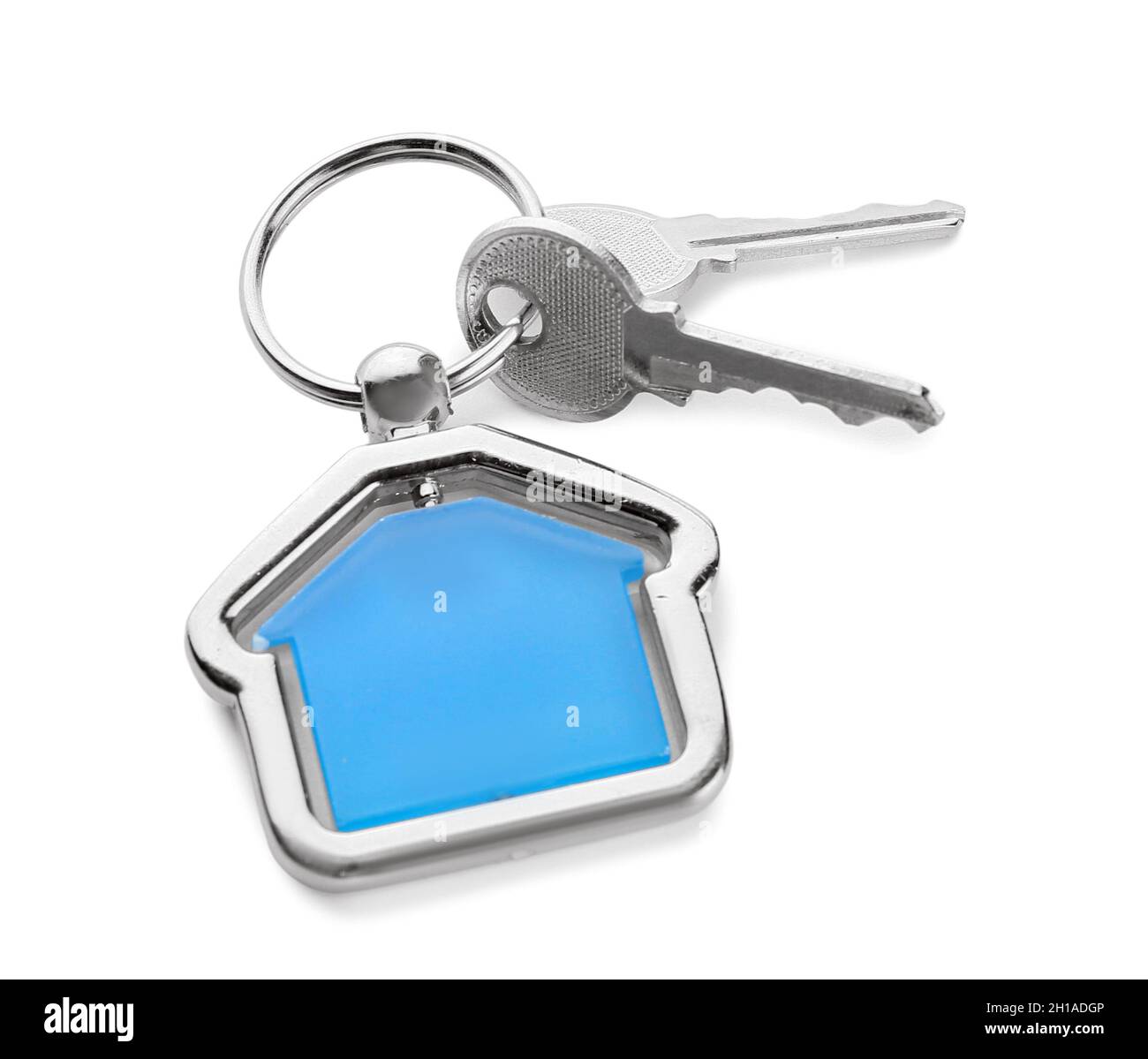 Patterned House Key Home keys with house shaped keychain on white background Stock Photo ...