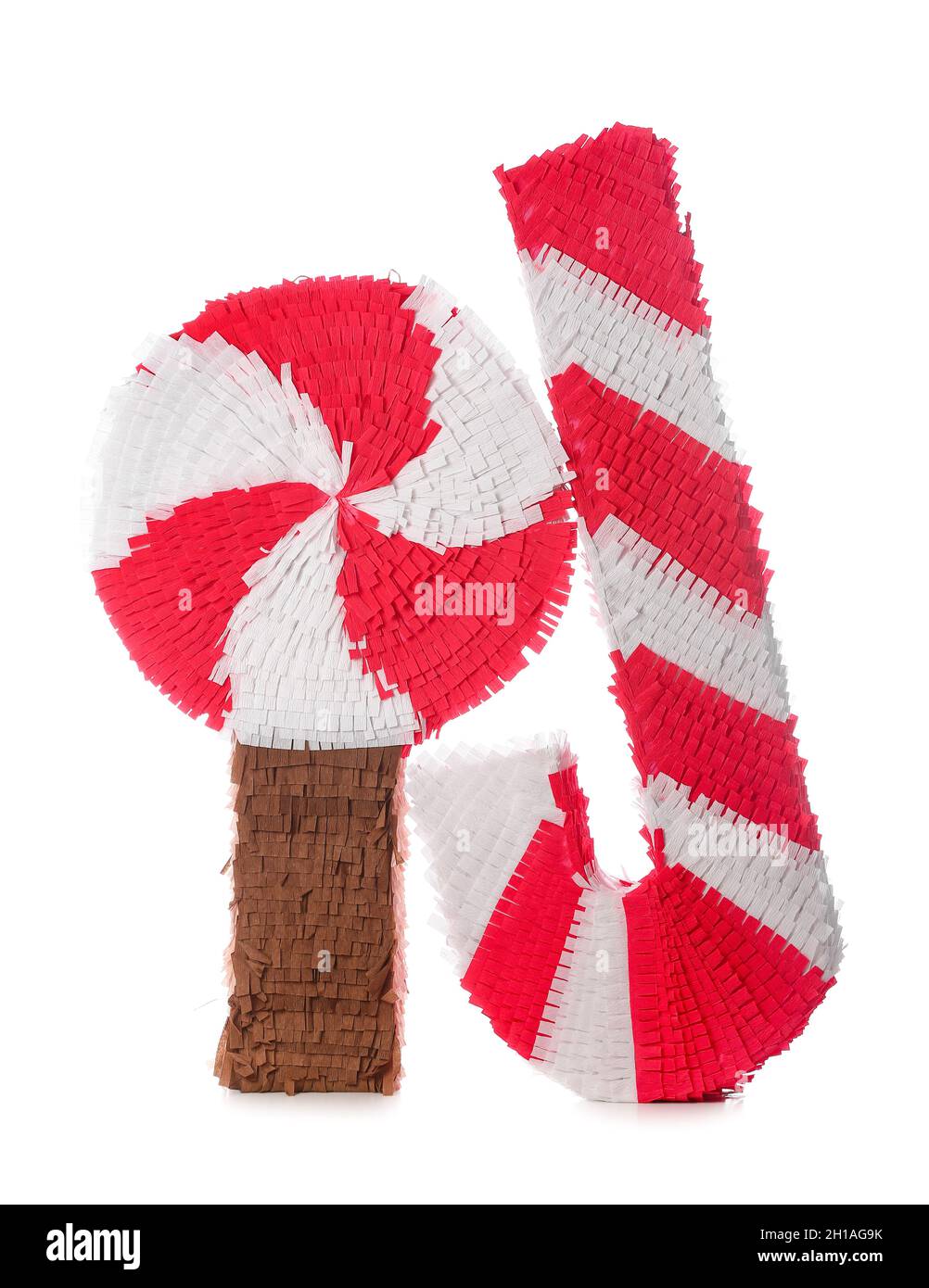 Mexican pinatas in shape of candy cane and lollipop on white background
