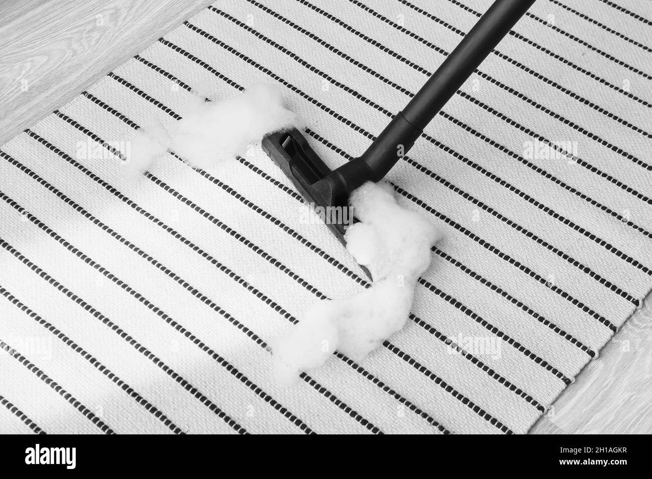 Vacuuming of carpet in room Stock Photo Alamy
