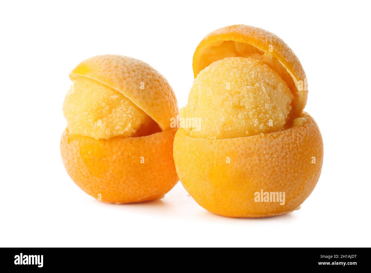 Tasty ice creams in orange peels on white background Stock Photo Alamy
