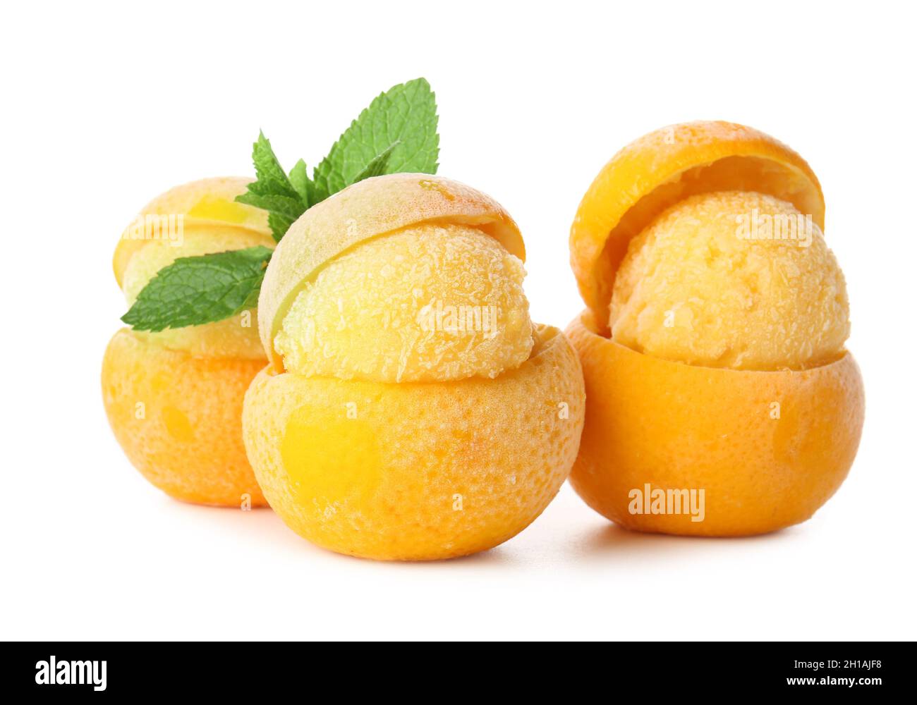 Tasty ice creams in orange peels on white background Stock Photo Alamy