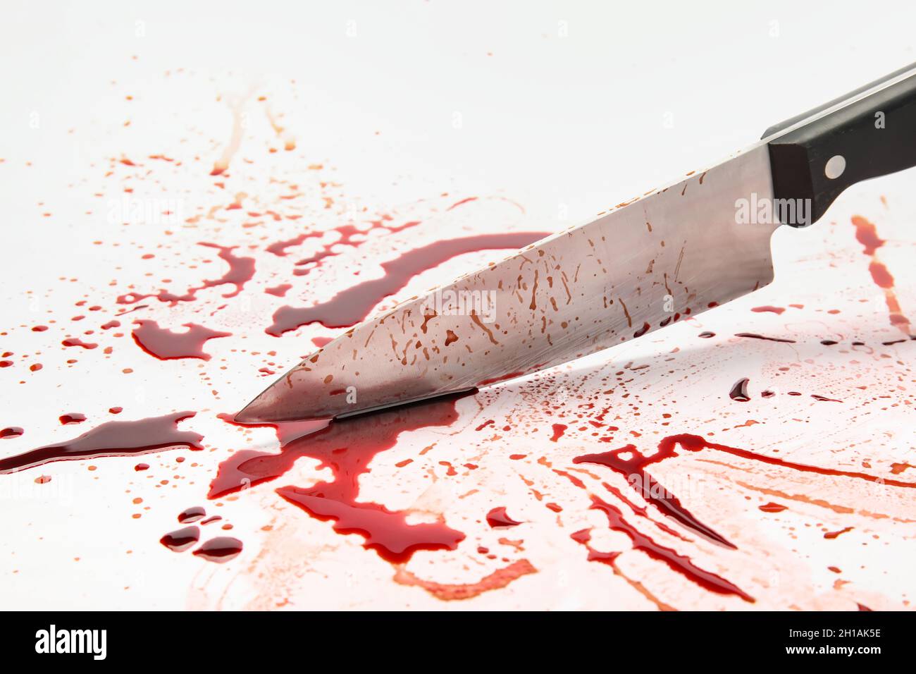 Knife with blood drops on white background Stock Photo