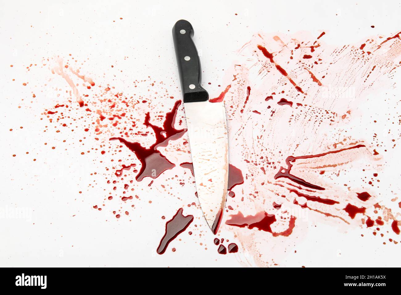 Knife with blood drops on white background Stock Photo