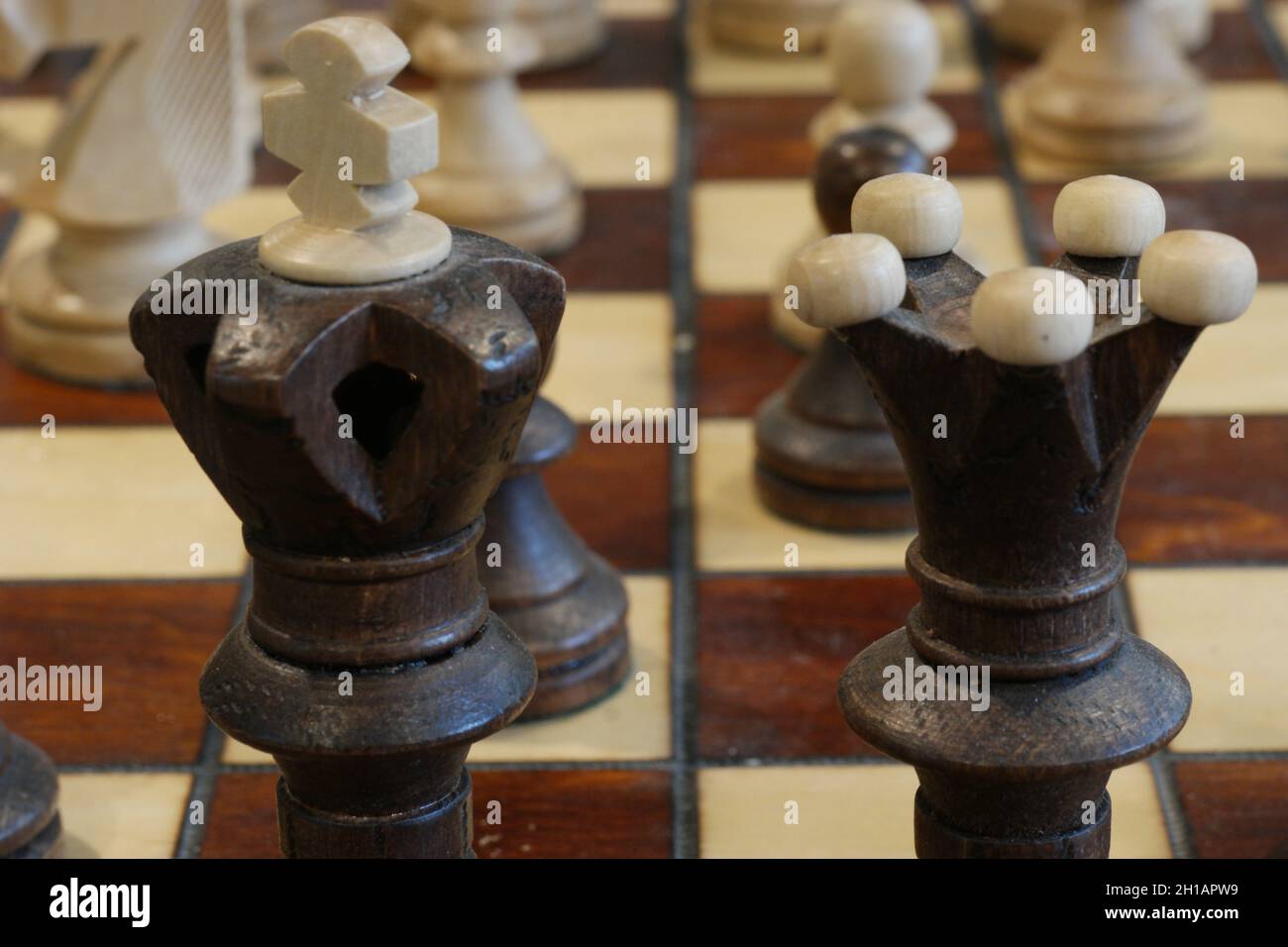 brown chess board with figures on a wooden table in a cafe, playing chess  Stock Photo - Alamy