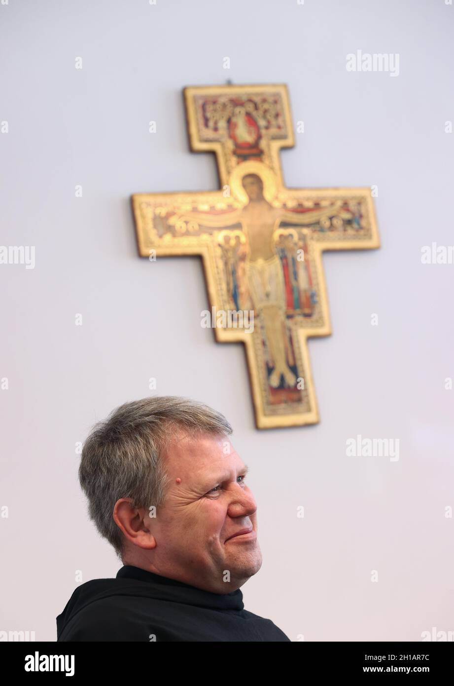 25 June 2021, Bavaria, Würzburg: Brother Adam, the house superior of the Würzburg convent of the Franciscan order, sits in a room of the monastery during a conversation. The monastery in Würzburg is the oldest surviving Franciscan monastery in Germany. (to dpa-Korr 'Behind monastery walls - 800 years of Franciscans in Germany') Photo: Karl-Josef Hildenbrand/dpa Stock Photo