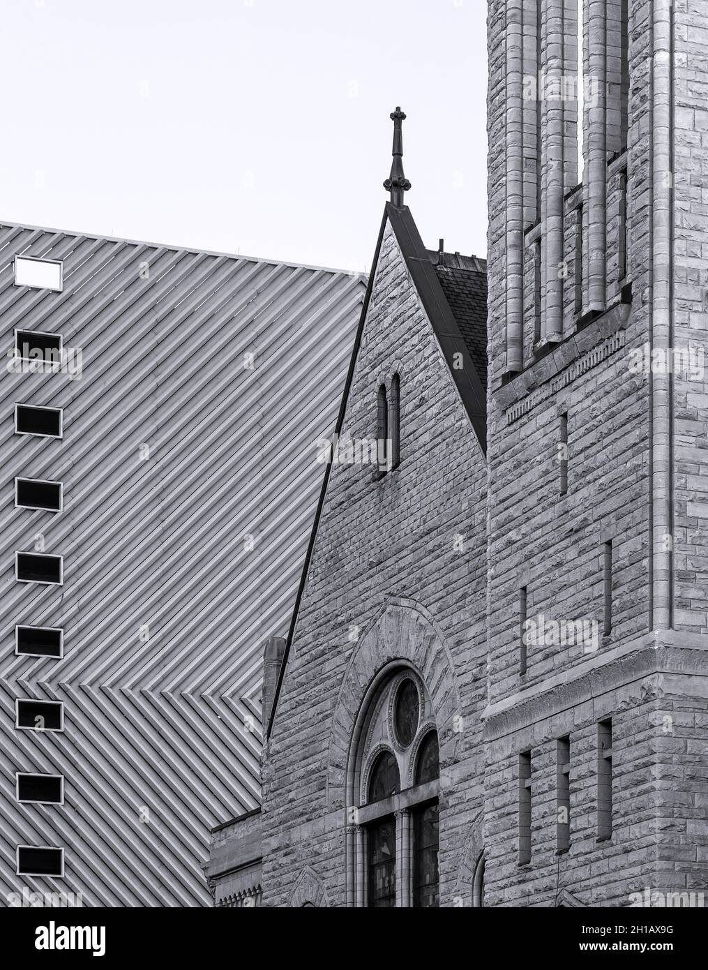 Historic brick Central Presbyterian Church in front of a modern