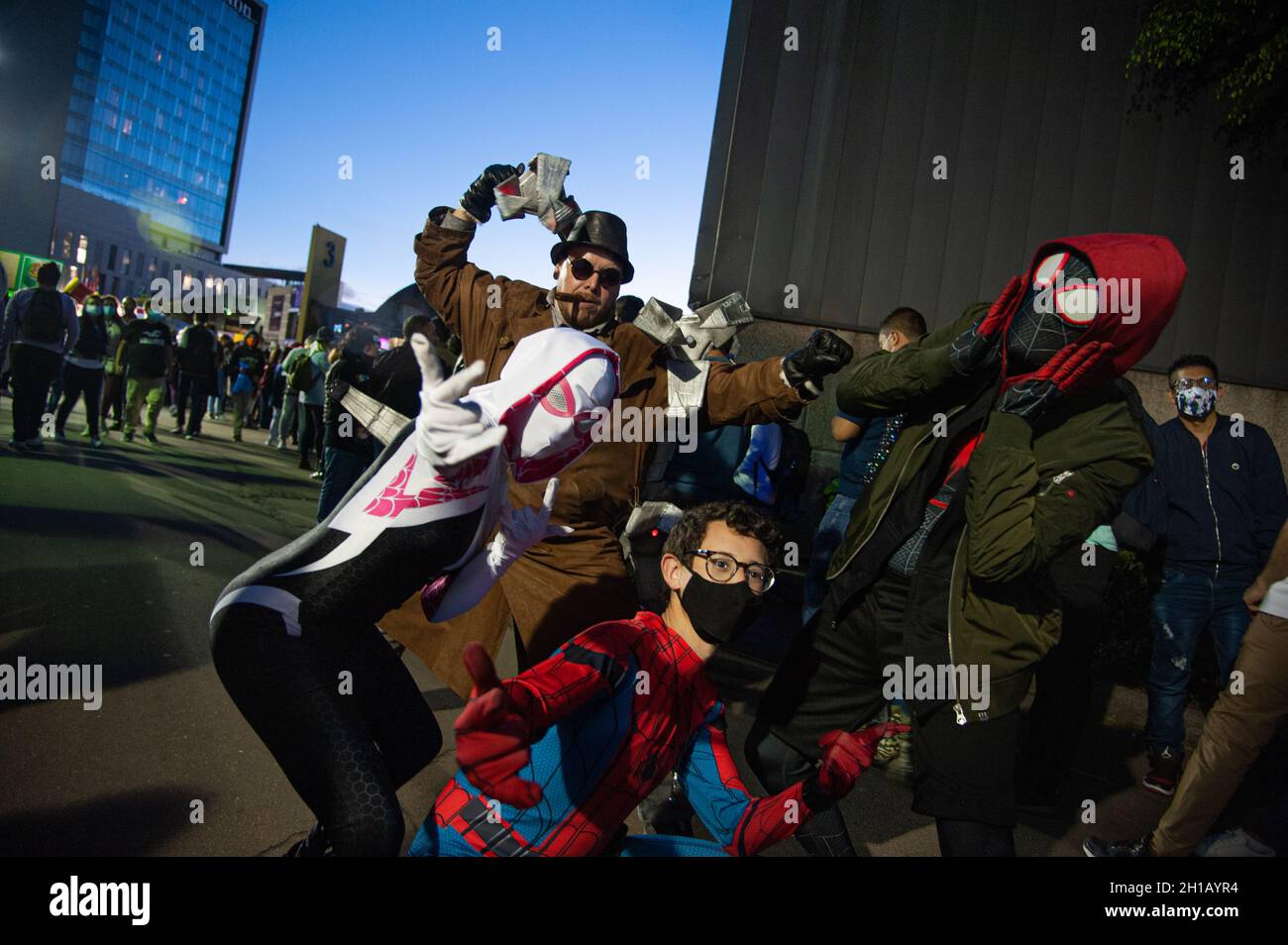 Fans of Spider Man movies and universe fight a men dressed as antagonist Dr. Octopus during the fourth day of the SOFA (Salon del Ocio y la Fantasia) 2021, a fair aimed to the geek audience in Colombia that mixes Cosplay, gaming, superhero and movie fans from across Colombia, in Bogota, Colombia on October 17, 2021. Stock Photo