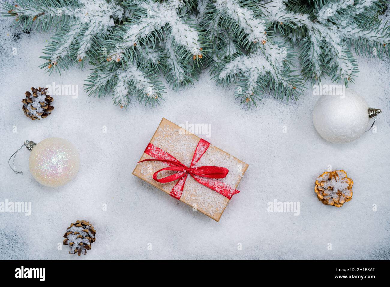Christmas background with gift boxes in snow Stock Photo