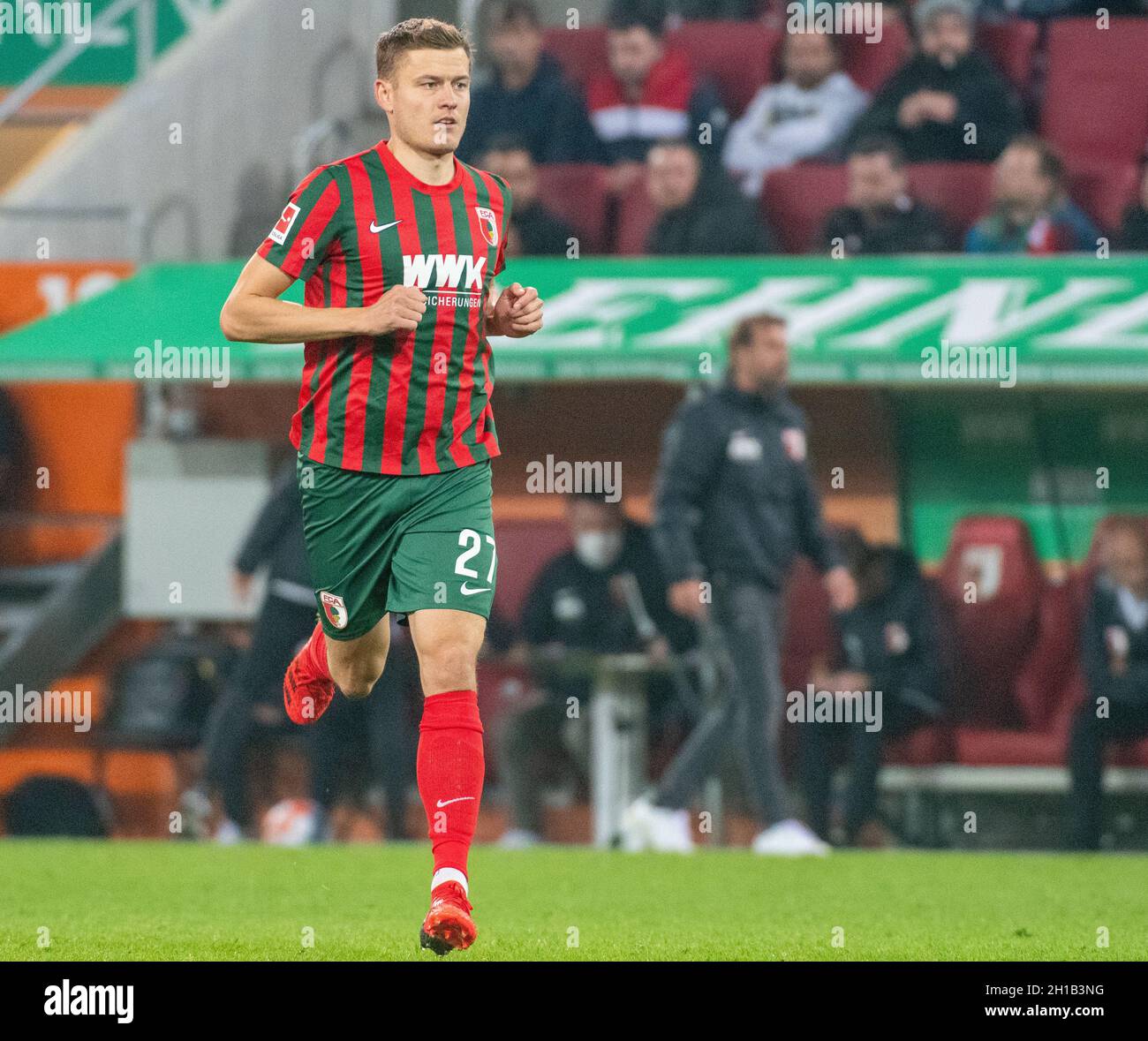 Augsburg, Germany. 17th Oct, 2021. Football: Bundesliga, FC Augsburg - Arminia Bielefeld, Matchday 8, at WWK Arena. Augsburg's Alfred Finnbogason runs onto the field. Credit: Stefan Puchner/dpa - IMPORTANT NOTE: In accordance with the regulations of the DFL Deutsche Fußball Liga and/or the DFB Deutscher Fußball-Bund, it is prohibited to use or have used photographs taken in the stadium and/or of the match in the form of sequence pictures and/or video-like photo series./dpa/Alamy Live News Stock Photo