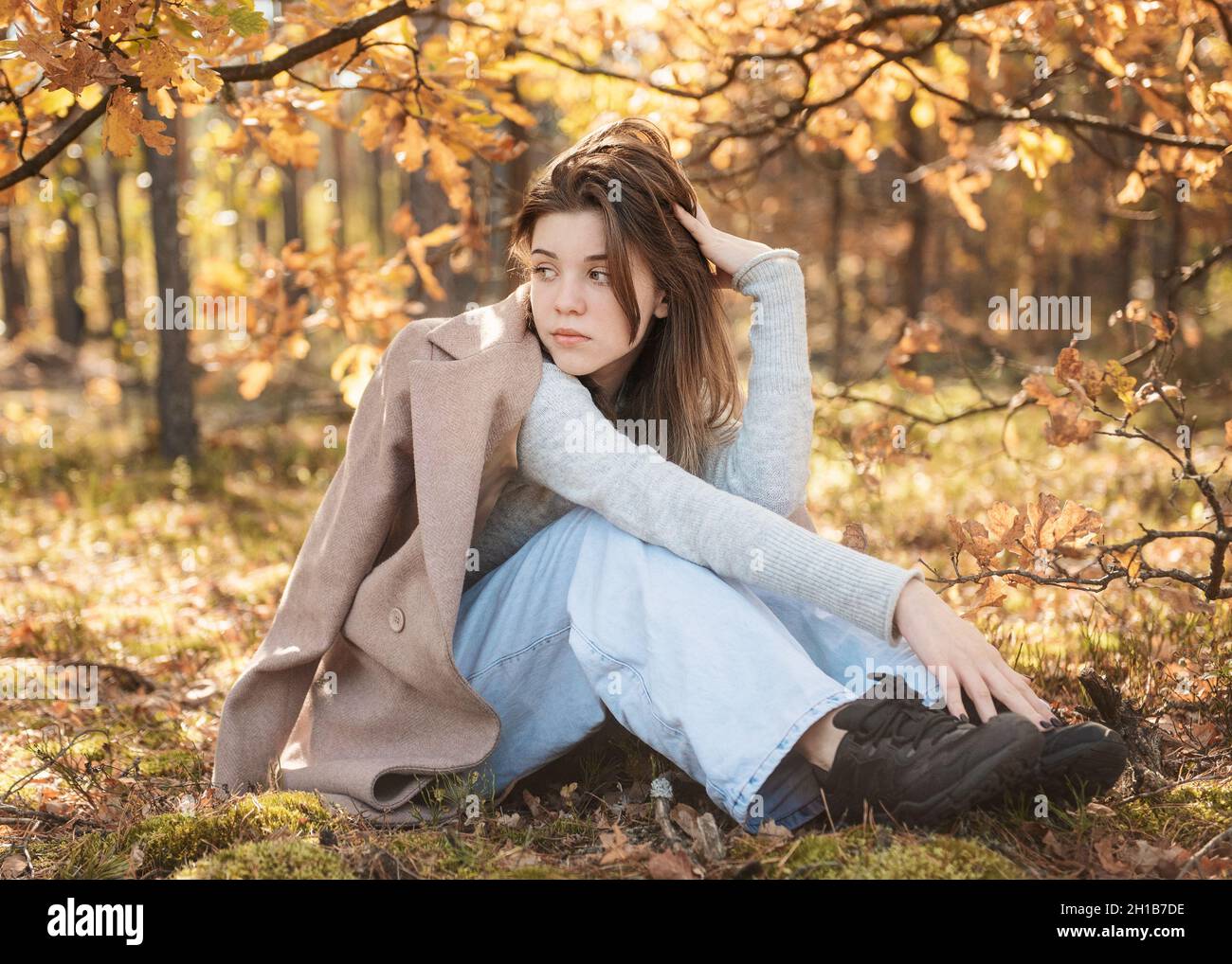 Young teenager girl in the autumn forest. Autumn colors . Lifestyle. Autumn mood. Forest Stock Photo