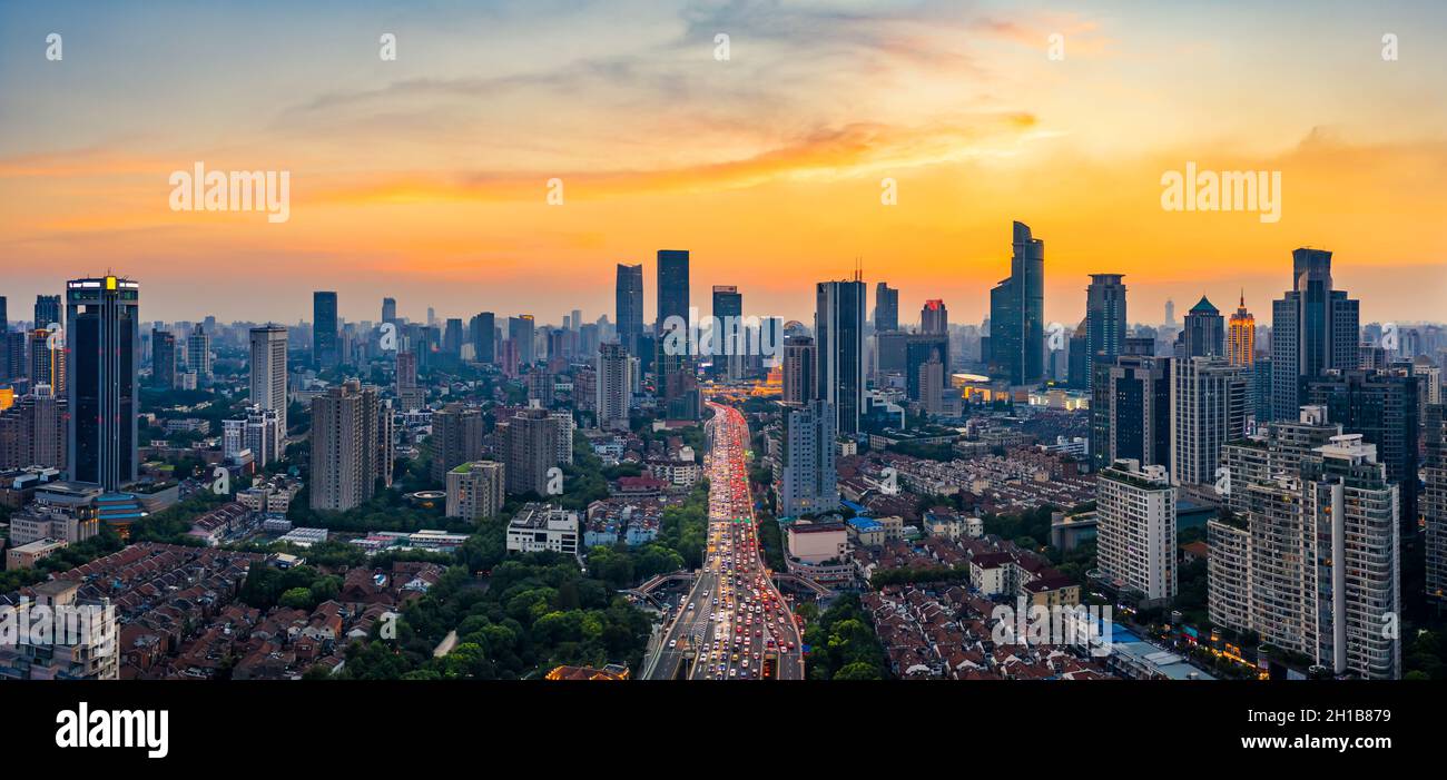 Shanghai skyline and buildings with highway at sunset. Stock Photo