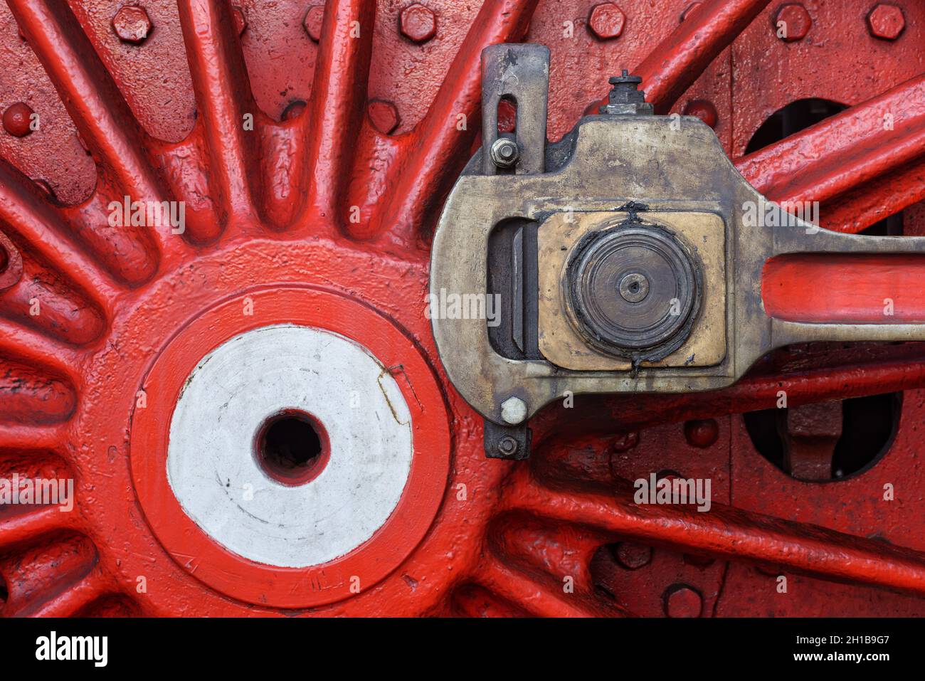 Backgrounds and textures: red steam locomotive wheel, close-up shot, industrial abstract Stock Photo