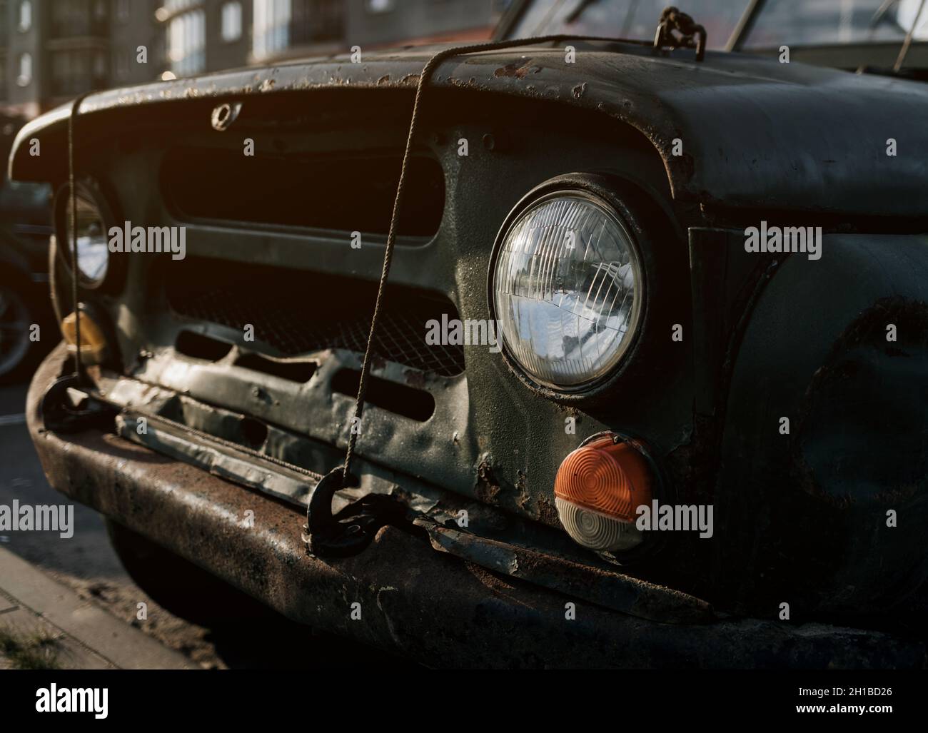 Details of the front headlights of an old car. Antique automobile with