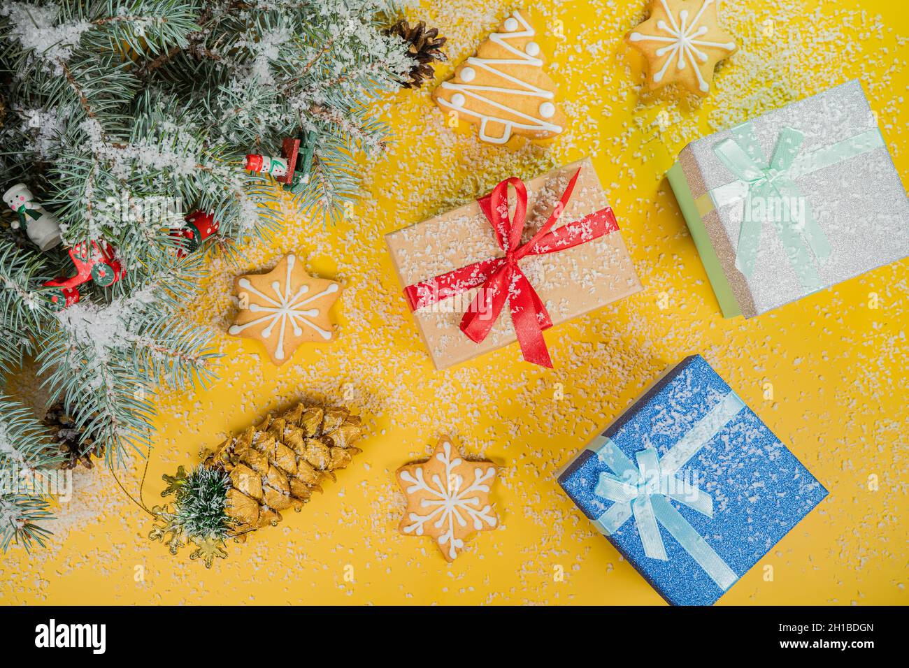 Christmas yellow background with gift boxes Stock Photo - Alamy