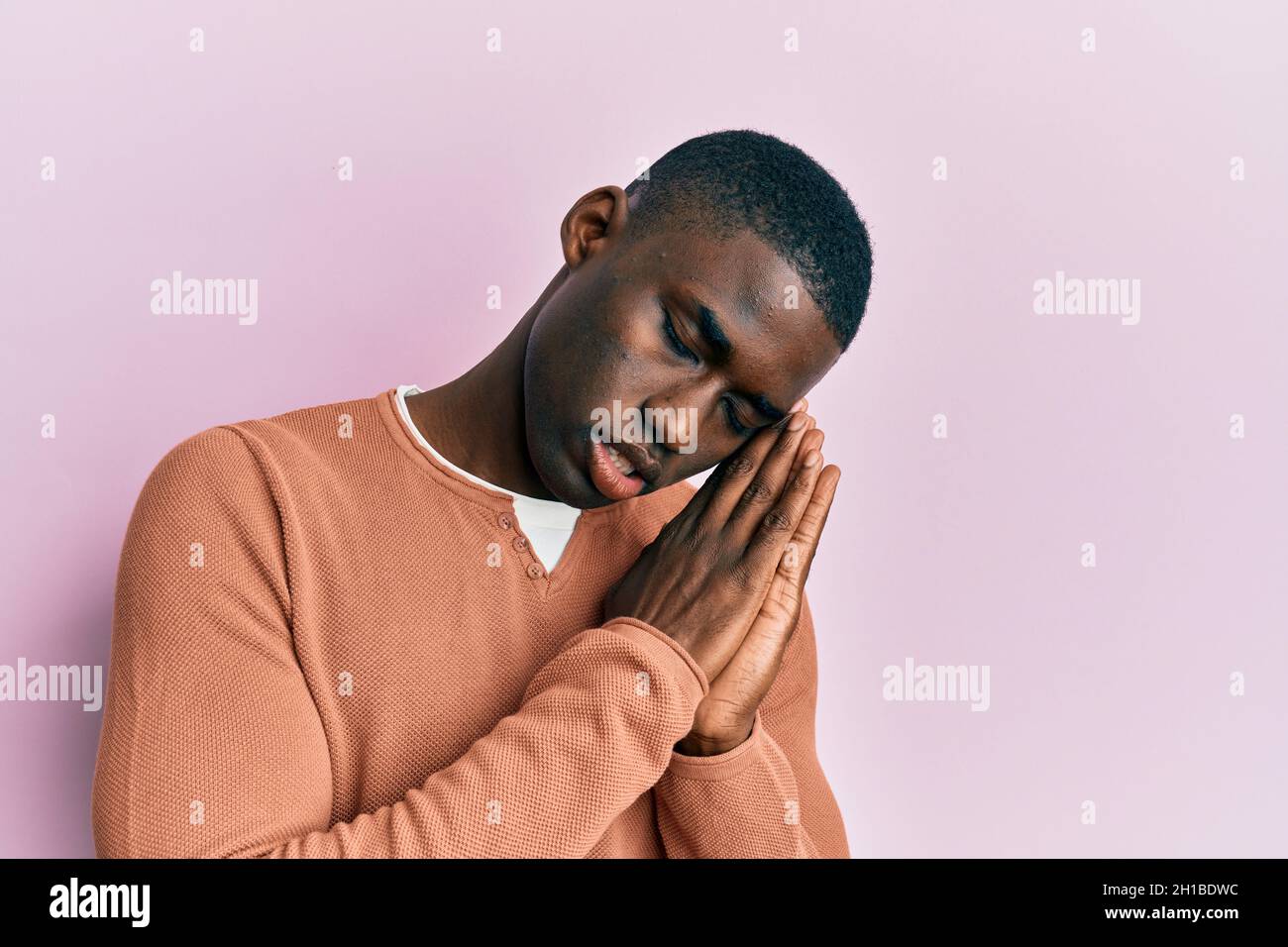 Young african american man wearing casual clothes sleeping tired ...