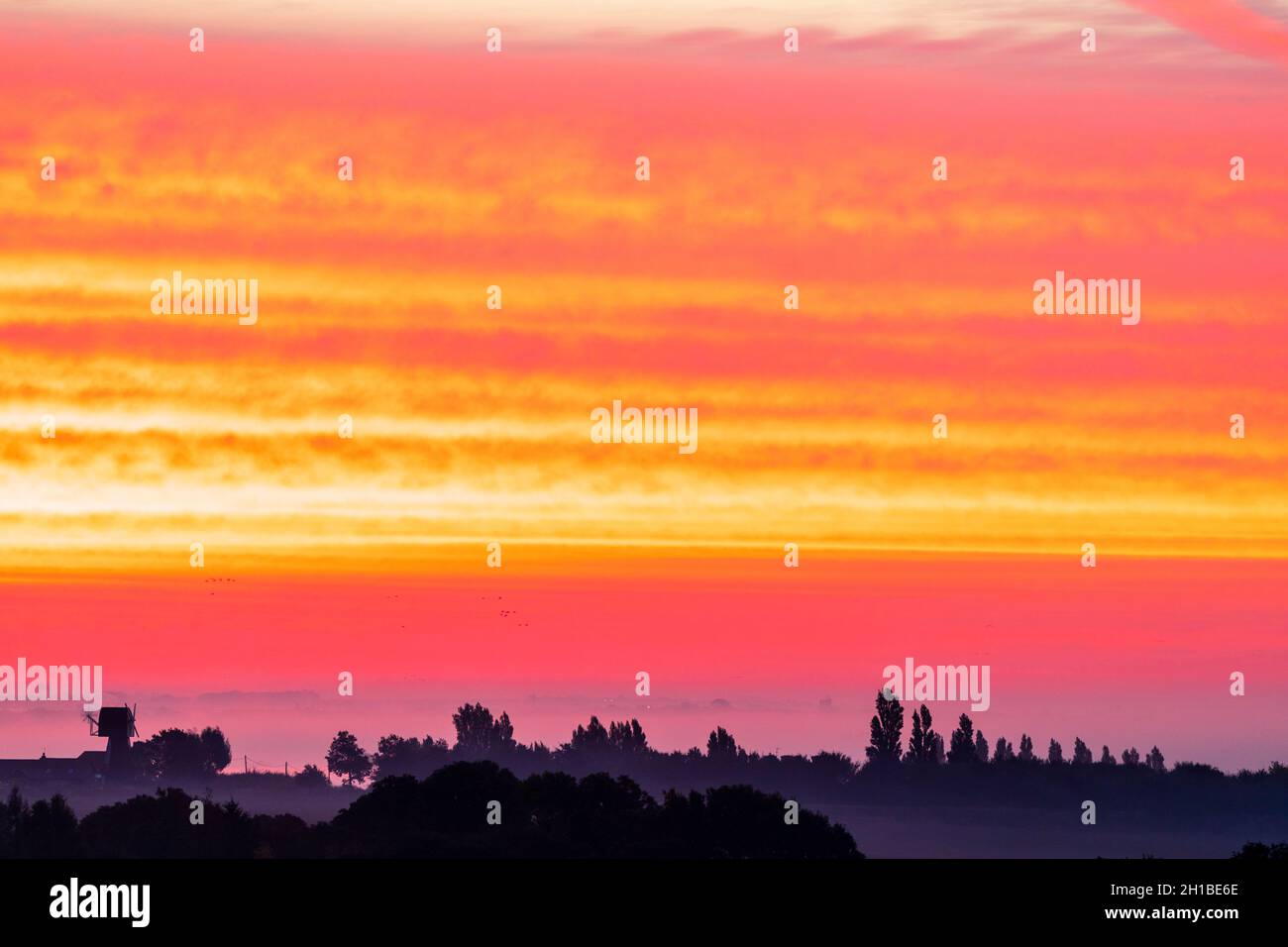 Very dramatic dawn sky over a mist covered Kent Landscape with some ...