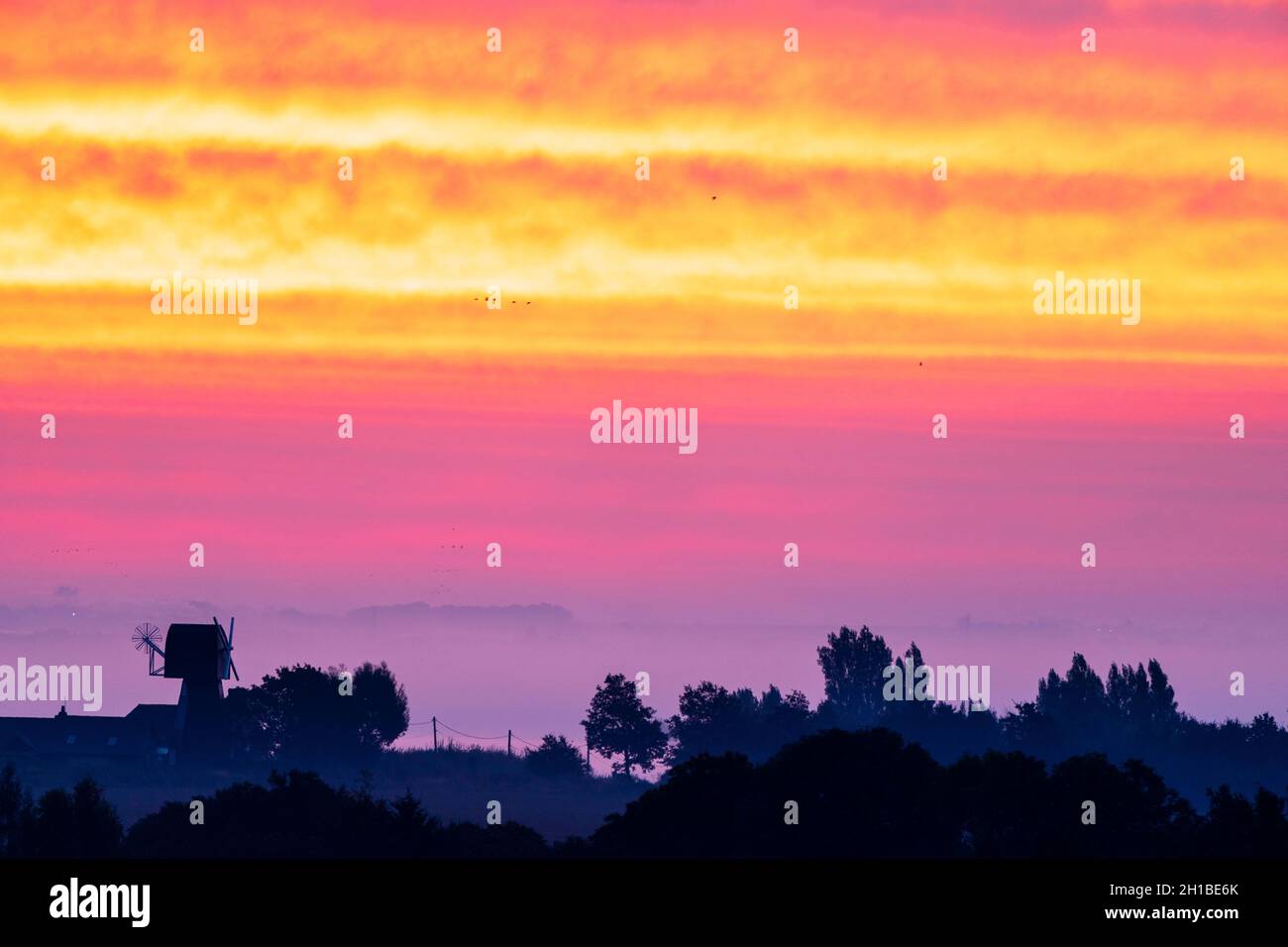 Very dramatic dawn sky over a mist covered Kent Landscape with some ...