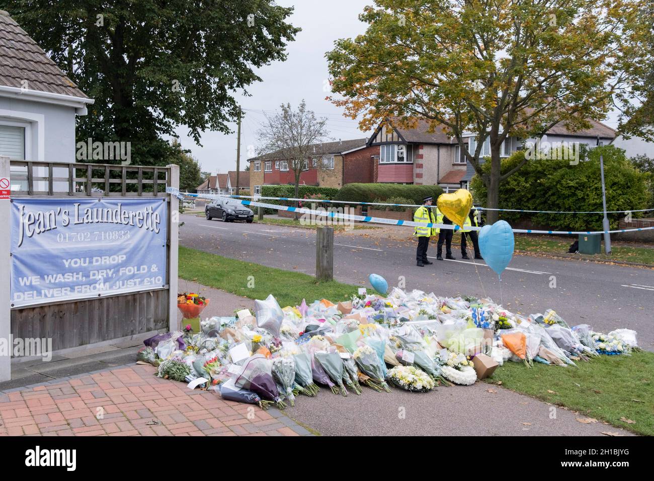 Two days after the killing of the Conservative member of parliament for Southend West, Sir David Amess MP, floral tributes are left in Eastwood Road North, a short distance from Belfairs Methodist Church in Leigh-on-Sea, on 17th October 2021, in Leigh-on-Sea, Southend , Essex, England. Amess was conducting his weekly constituency surgery when attacked with a knife by Ali Harbi Ali. Stock Photo