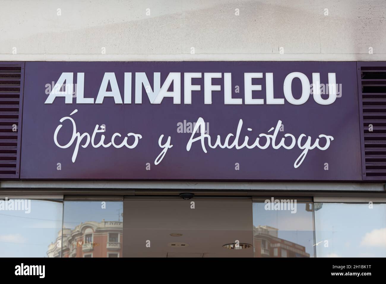 VALENCIA, SPAIN - OCTOBER 14, 2021: French company Alain Afflelou shop logo Stock Photo