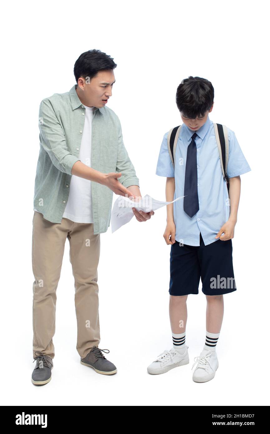 Angry father scolding his son Stock Photo