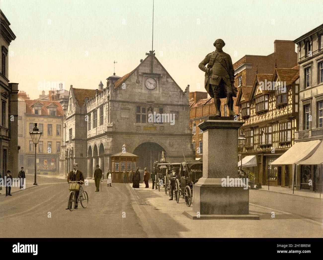 Vintage photochrome colour photo circa 1890 of The Old Market Hall built in 1596 on the Square in the centre of Shrewsbury an historic town in England dating back to the medieval period with the statue of Robert Clive (Clive of India) in the foreground Stock Photo