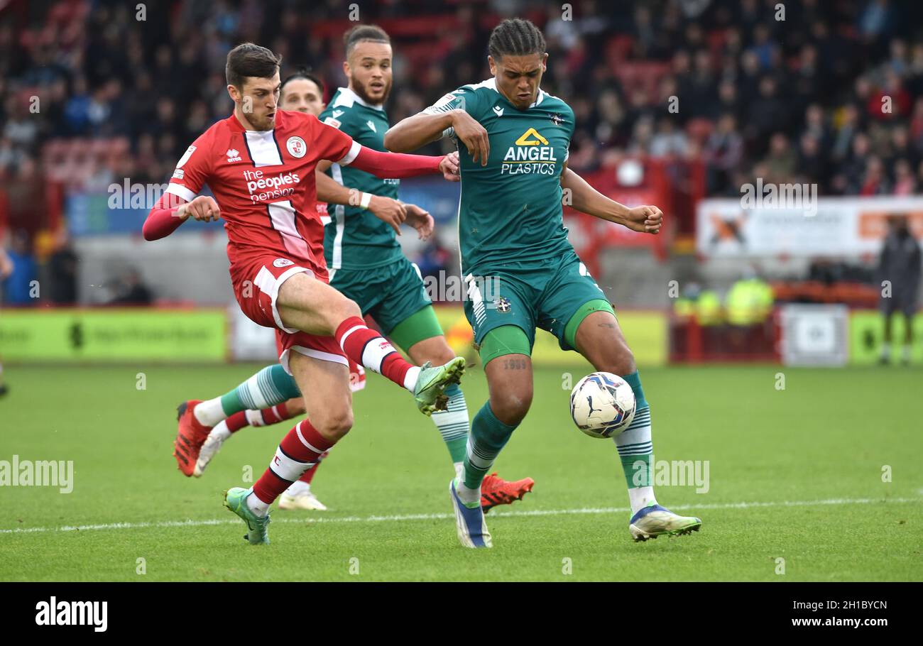 Ashley Nadesan of Crawley (left) tries to shoot past Coby Rowe of Sutton United during the Sky Bet League Two match between Crawley Town and Sutton United at the People's Pension Stadium  , Crawley ,  UK - 16th October 2021 Editorial use only. No merchandising. For Football images FA and Premier League restrictions apply inc. no internet/mobile usage without FAPL license - for details contact Football Dataco Stock Photo