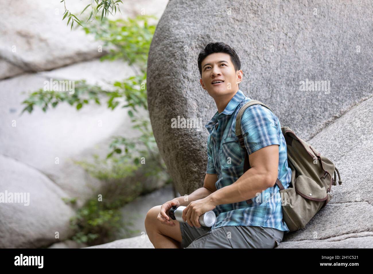 Young chinese man hiking hi-res stock photography and images - Alamy