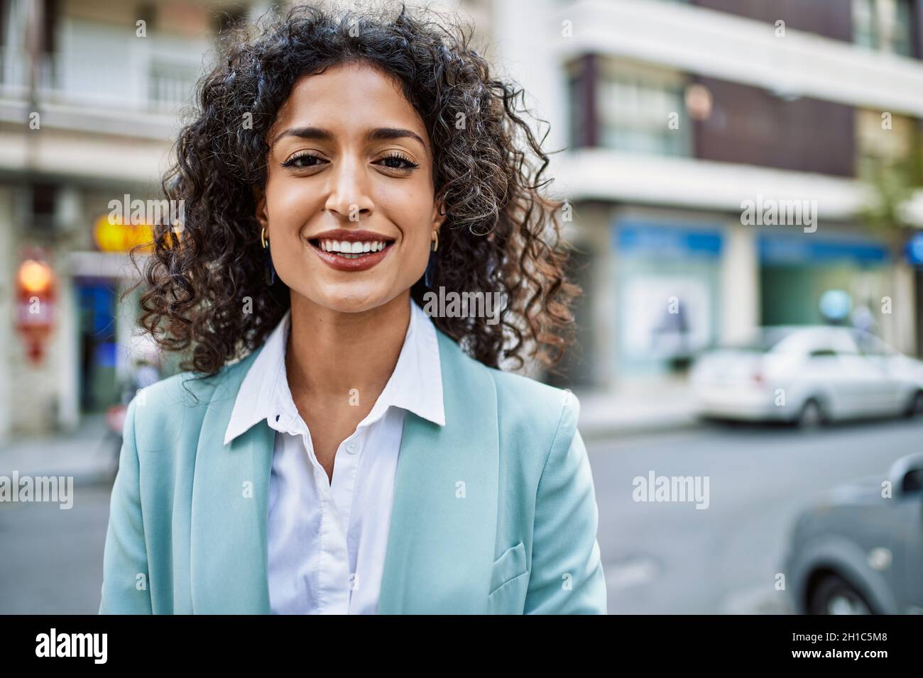 Young hispanic business woman wearing professional look smiling ...
