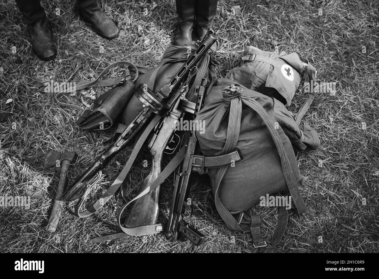 Soviet Russian Military Infantry Ammunition On Ground World War II Soviet Red Army Weapon. Submachine Guns PPS-43 And PPSh-41 On Ground. WWII WW2 Stock Photo