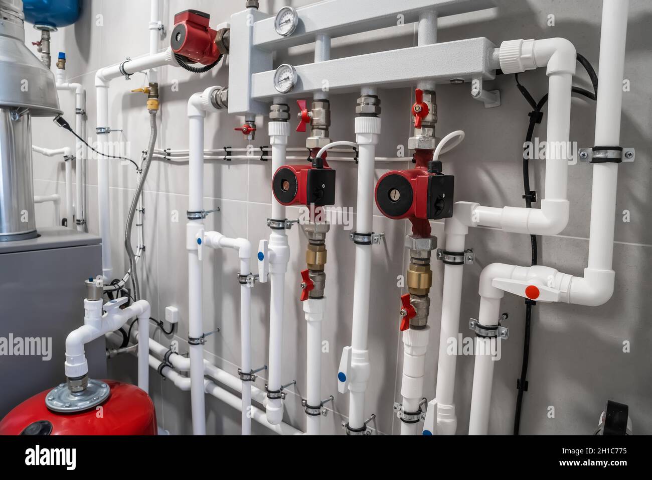 House heating system with modern plastic pipes, manometers and tubes