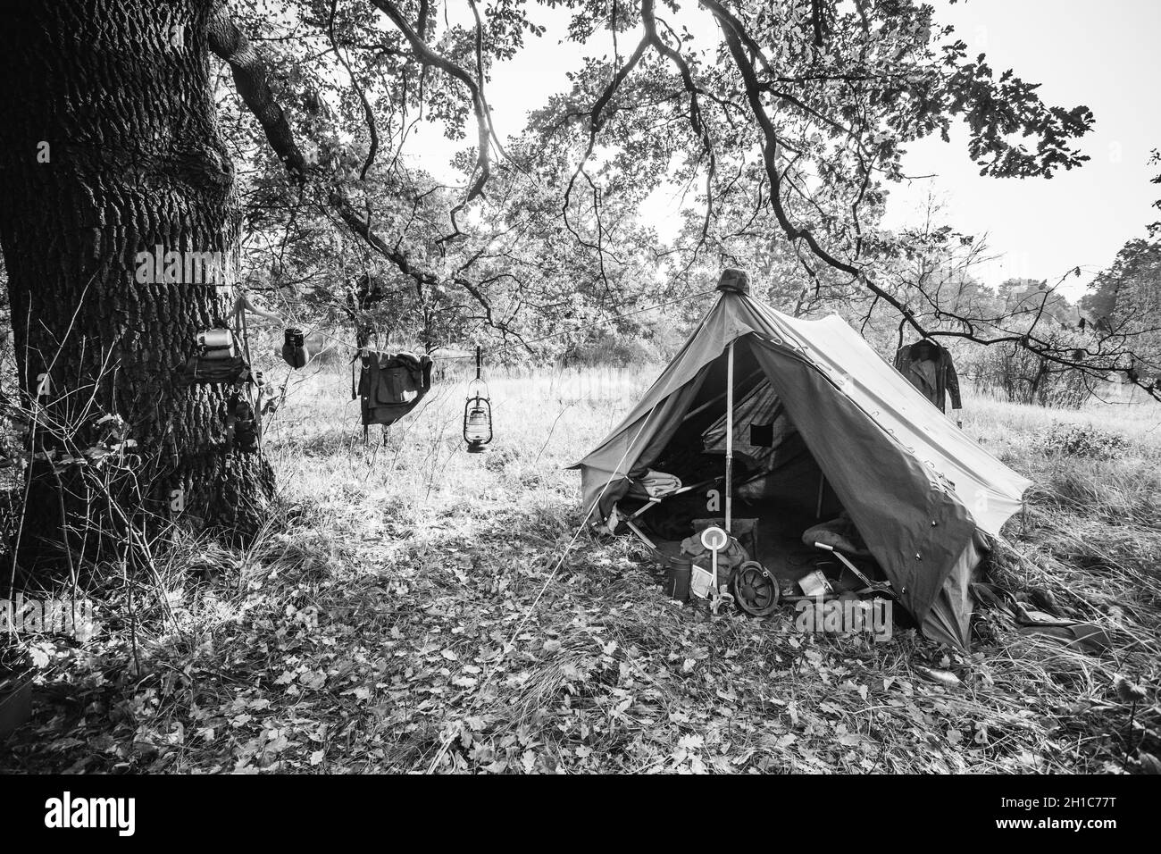 World War II German Wehrmacht Infantry Tent In Forest Camp. WWII WW2 German Ammunition. Photo In Black And White Colors Stock Photo