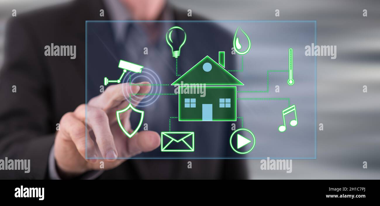 Man touching a digital smart home automation concept on a touch screen ...