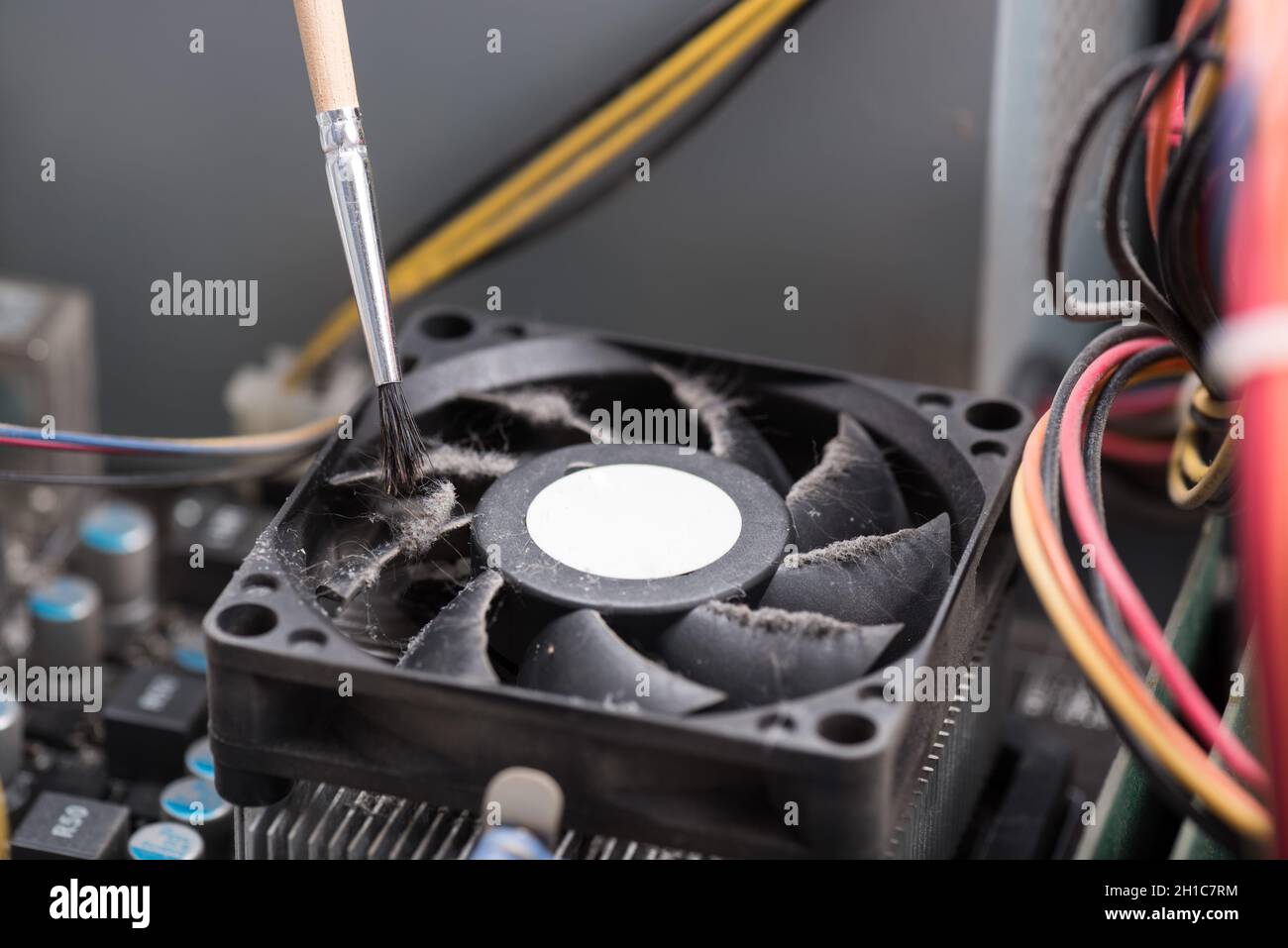 Cleaning a processor fan with a brush Stock Photo Alamy
