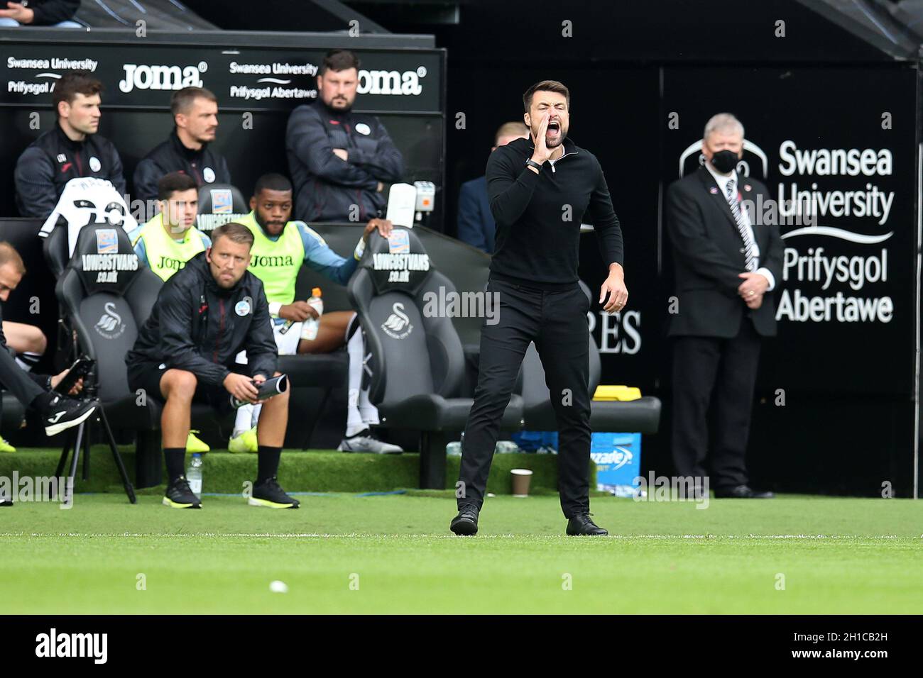 Russell Martin, the head coach/manager of Swansea city shouts his instructions to players from the touchline. EFL Skybet championship match, Swansea city  v Cardiff City at the Swansea.com Stadium in Swansea on Sunday 17th October 2021.  this image may only be used for Editorial purposes. Editorial use only, license required for commercial use. No use in betting, games or a single club/league/player publications. pic by  Andrew Orchard/Andrew Orchard sports photography/Alamy Live news Stock Photo
