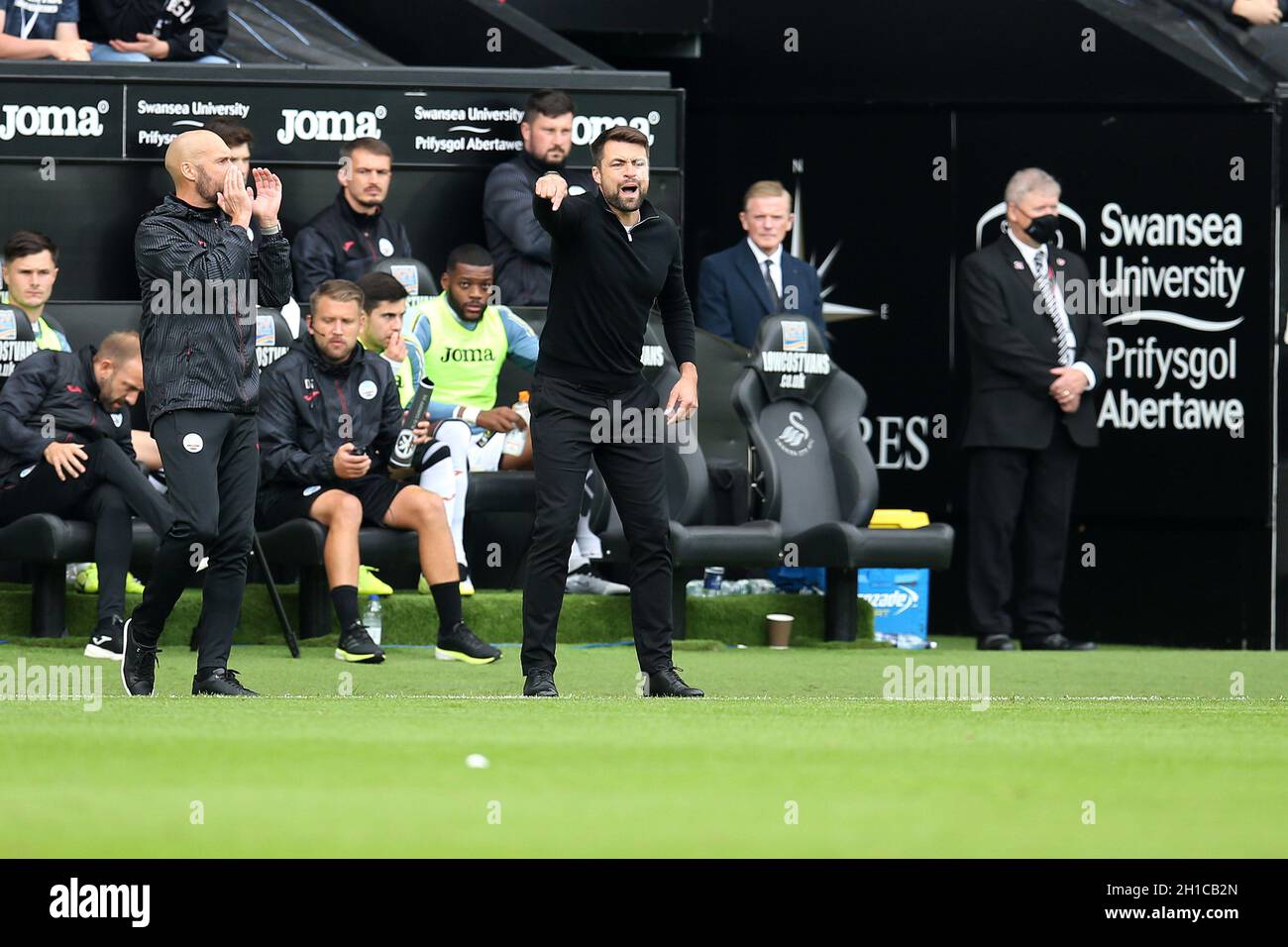 Russell Martin, the head coach/manager of Swansea city instructs his players from the touchline. EFL Skybet championship match, Swansea city  v Cardiff City at the Swansea.com Stadium in Swansea on Sunday 17th October 2021.  this image may only be used for Editorial purposes. Editorial use only, license required for commercial use. No use in betting, games or a single club/league/player publications. pic by  Andrew Orchard/Andrew Orchard sports photography/Alamy Live news Stock Photo
