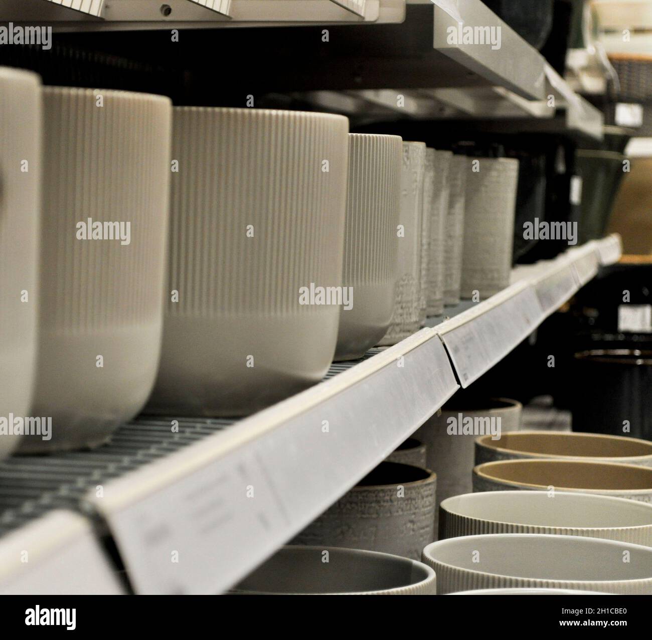 Various ceramic plant pots on shelves at IKEA, Sheffield, England Stock